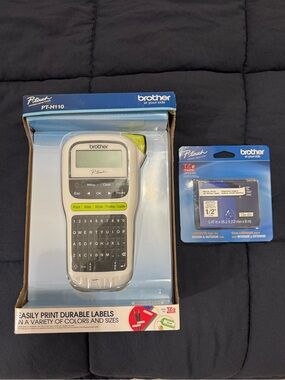 Brother handheld label maker box in blue with white and black accents.
